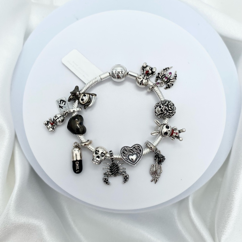 Linx Snake Chain Bracelet with Black Skull Themed Charms